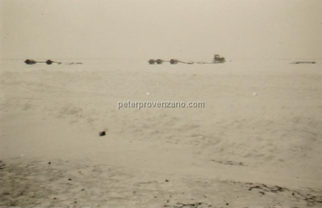 Peter Provenzano Photo Album Image_copy_135.jpg - Trucks pulling rollers to pack down the snow on the runways, taxieways, and tarmac. Winter of 1942, Canada.